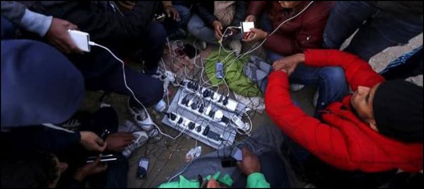 Sun-powered phone charger gives migrants in Greece free electricity