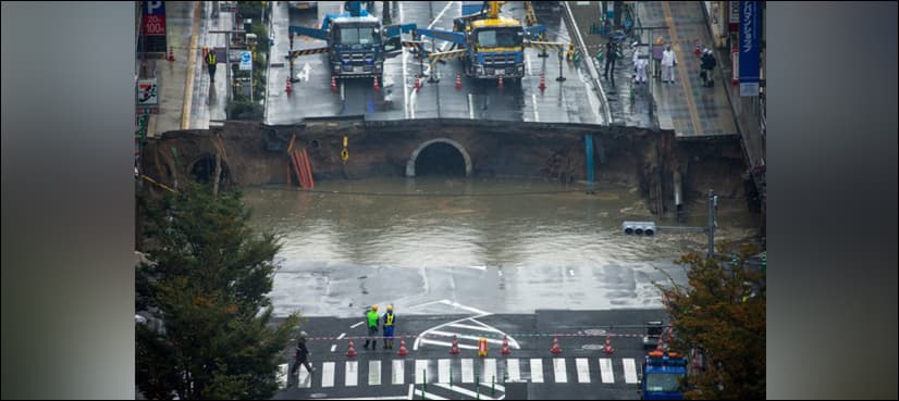 Giant sinkhole swallows road in Japan