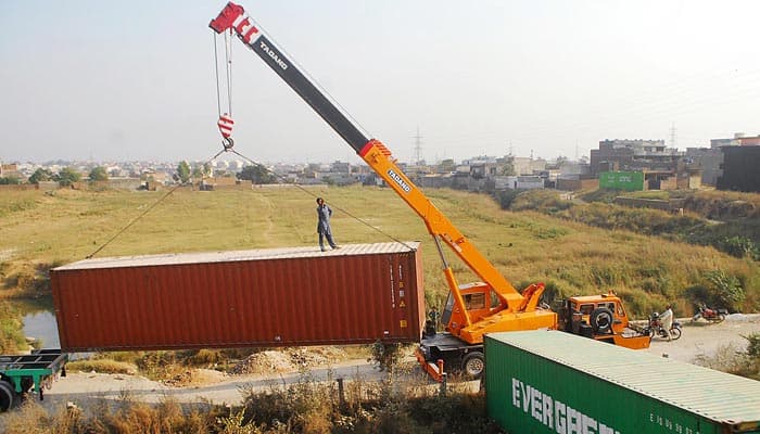 Two die, 14 hurt as container carrying Afghan families upturns