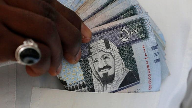 Saudi Arabia triples VAT, suspends handouts