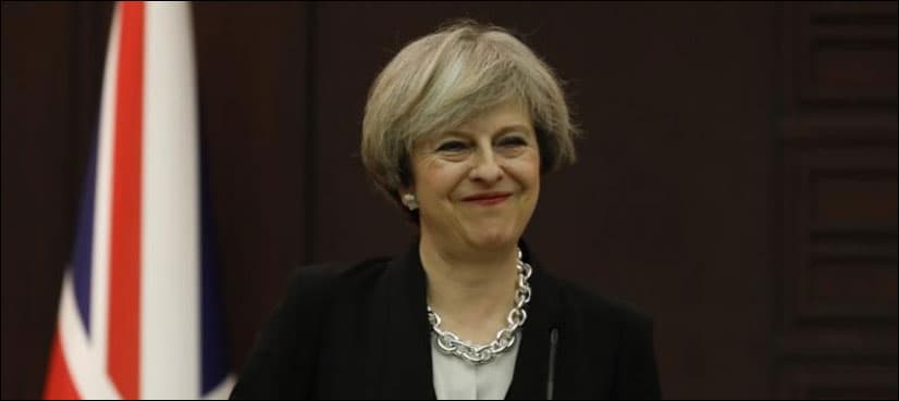 Despite Trump backlash, May says 'very happy' to invite him
