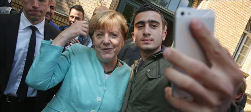 Hounded over Merkel selfie, Syrian refugee sues Facebook