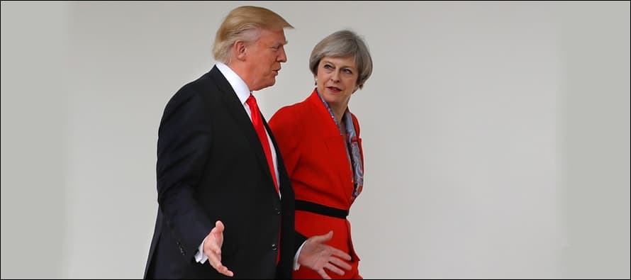 Trump travel ban 'divisive and wrong': May