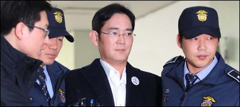 Arrested Samsung heir appears handcuffed for questioning