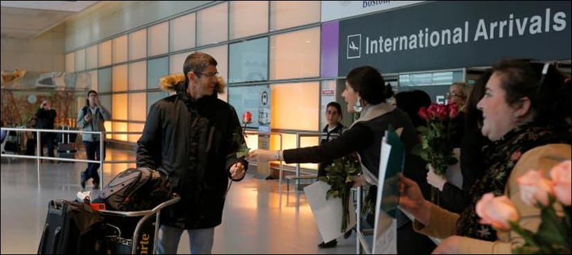 Some airlines board barred passengers after blow to Trump travel ban