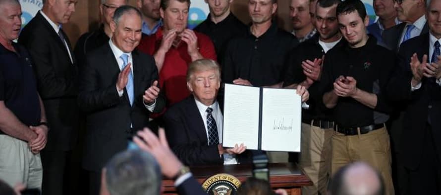 Trump signs order sweeping away Obama-era climate policies