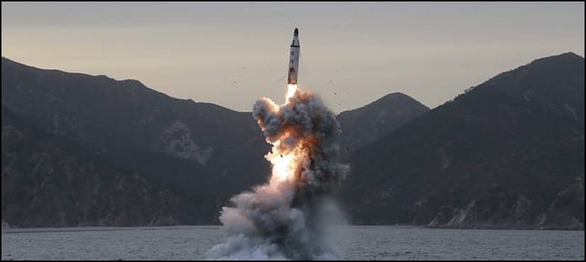 North Korea threatens more missile tests