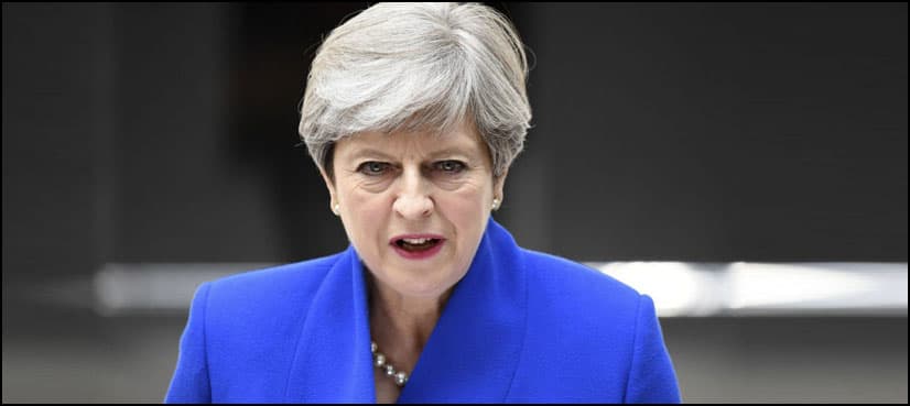 Defiant May vows to stay on despite UK election blow