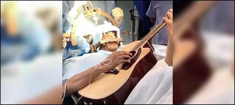 Man plays guitar during brain surgery