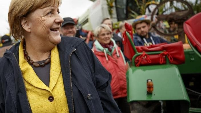 Germany votes as history beckons for Merkel, and far-right