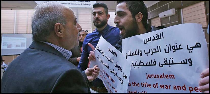 One sign read 'Zionism = Nazism = Fascism'