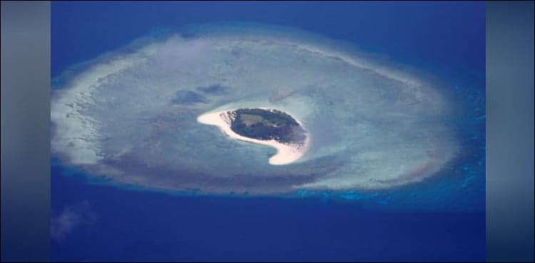 US warship sails near disputed South China Sea islands: US official