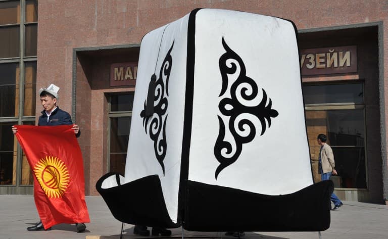 Kyrgyzstan backs new flag, says 'smiling' sun to aid growth