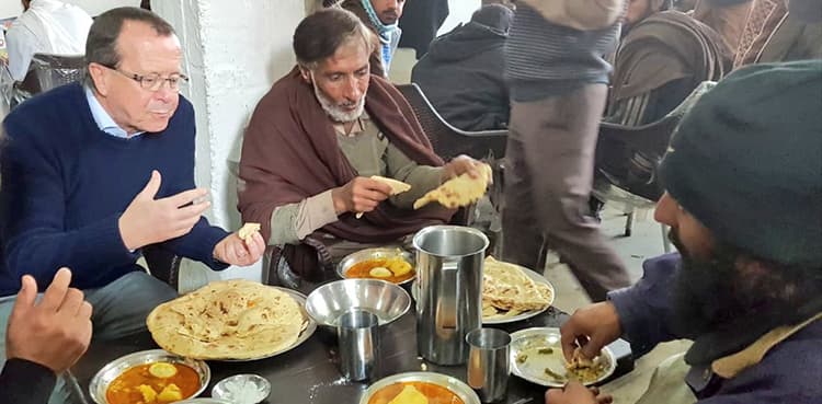 German ambassador shares a meal with the homeless in Islamabad