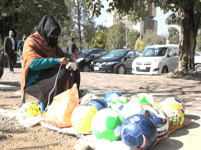 Abida Parveen is a skillful woman from Islamabad who sews and sells footballs to provide for her children and ailing husband