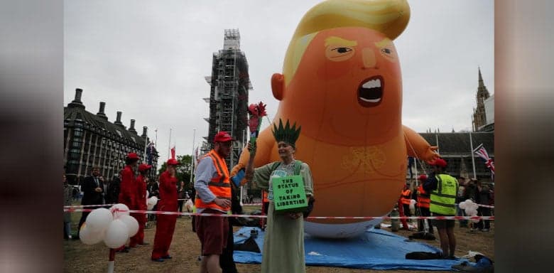 Trump turns to Brexit and Huawei as protesters mock with a 'blimp'
