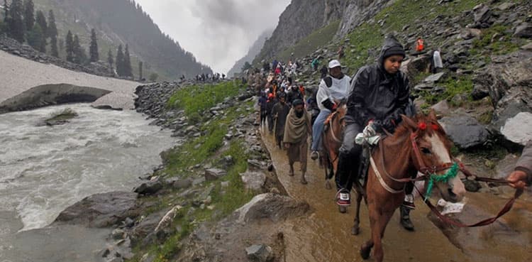 Thousands flee disputed Kashmir region after tensions flare, India beefs forces