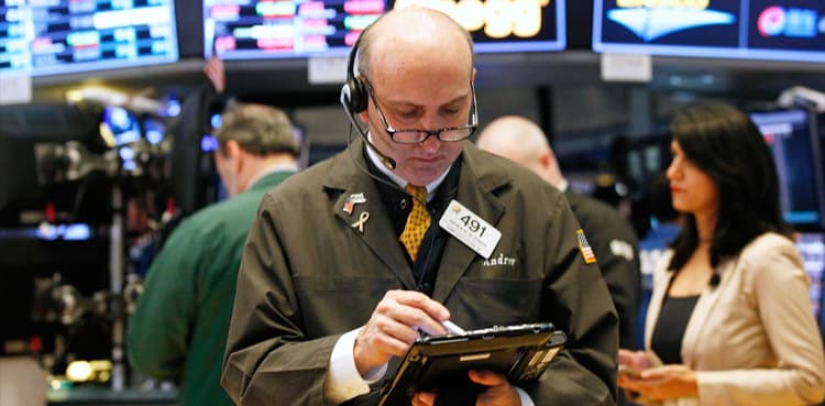 Global stocks end 2019 near record highs, dollar slides