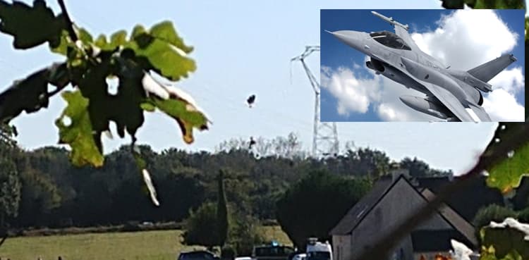 Pilot hangs on power line after F-16 crash