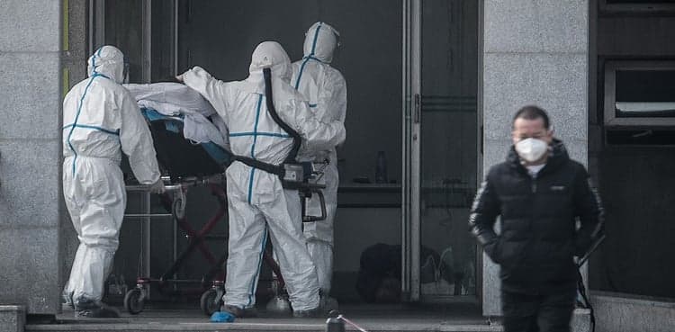 China locks down epicenter of virus outbreak; nearly 600 infected