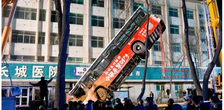 Huge sinkhole swallows bus, kills six