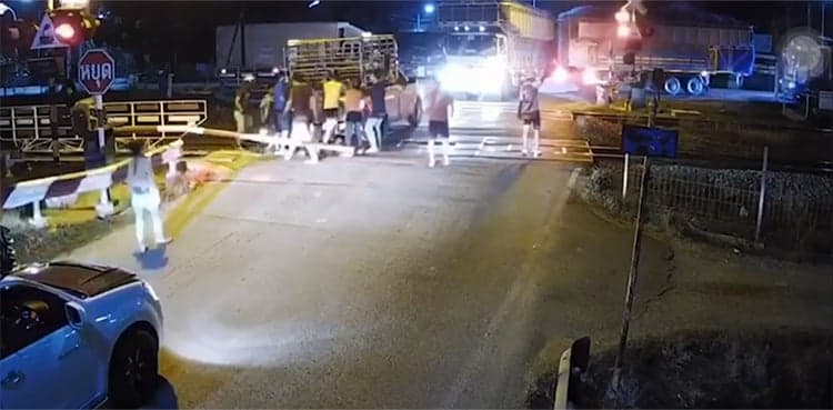 WATCH: Train smashes into truck stuck on level crossing