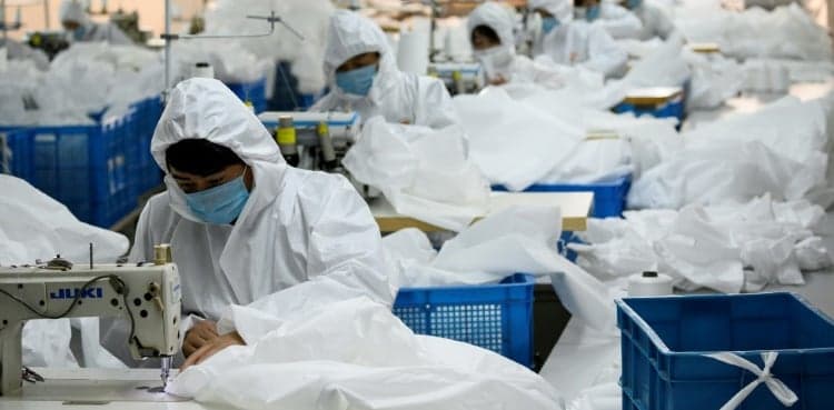 In coronavirus-hit China, coat maker adapts to make hazmat suits