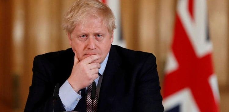 Back at work, British PM warns against easing virus lockdown
