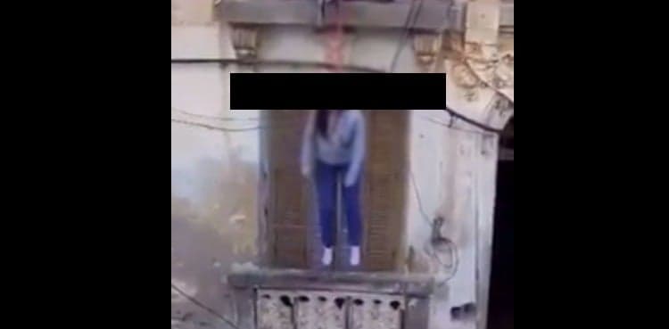 Does this viral video show a woman who committed suicide after contracting COVID-19?