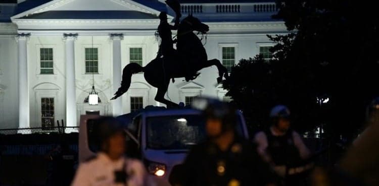 Four men charged for trying to pull down statue outside White House