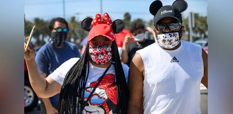 California theme parks remain shut but hundreds flock to Disney shops
