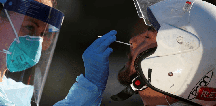 Australia reports jump in daily new cases, record deaths