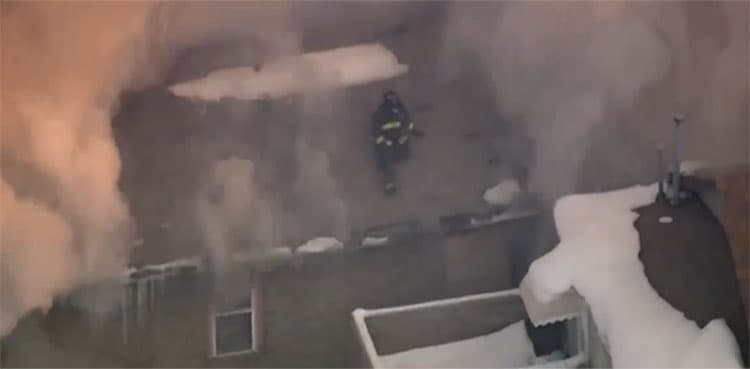Video captures firefighter jumping from building to flee fire