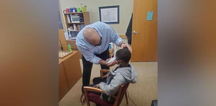 Principal fixes insecure student's hair instead of punishing him for wearing hat