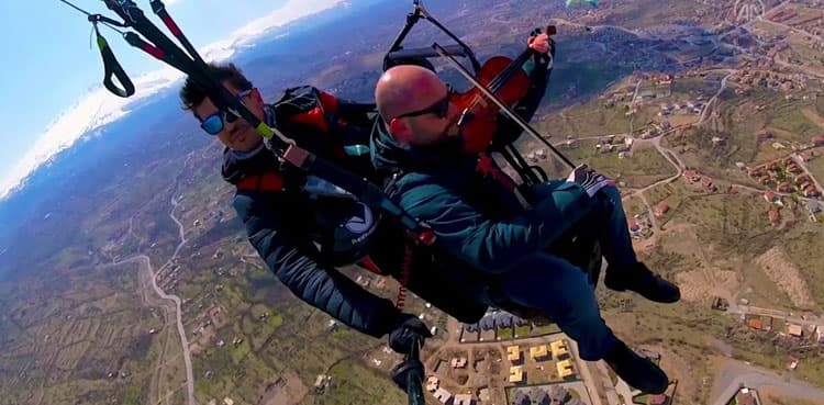 WATCH: Paraglider plays violin to soothe first flight nerves