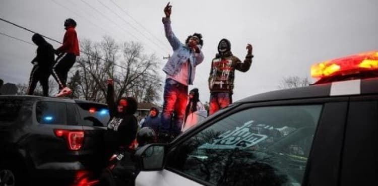 Police vehicles vandalized after man who was shot by police dies