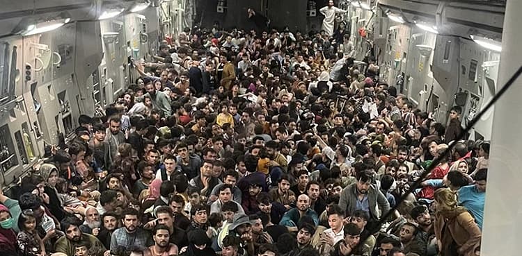More than 600 fleeing Afghans cram into dramatic US military flight