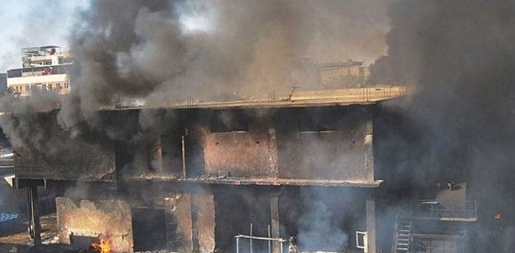 Distressed father searching son after Karachi factory fire dies of heart attack