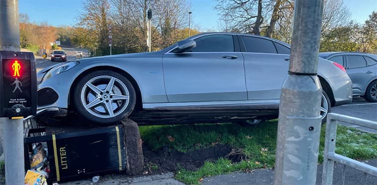 Driver accidentally hits accelerator, crashes expensive car into dustbin