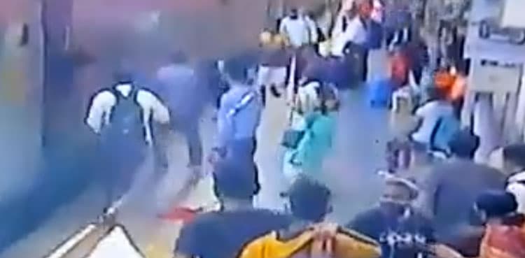 VIRAL: Man saves passenger being dragged under moving train!