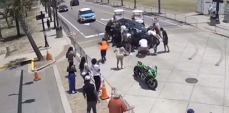 Video showing strangers rescuing man trapped under vehicle goes viral
