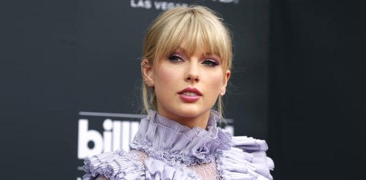 Taylor Swift wins top MTV video award, announces new album