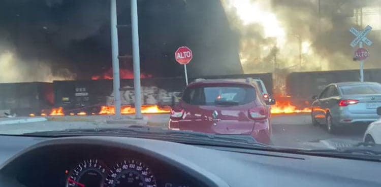 Cargo train runs through huge flames, video goes viral