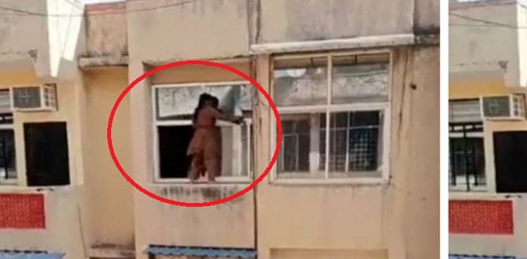 Woman stands on ledge of fourth floor window, terrifying video goes viral