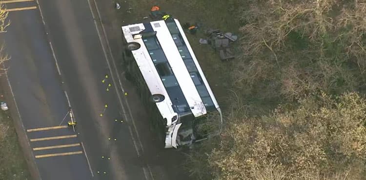 Double-decker bus overturns in crash with motorcycle