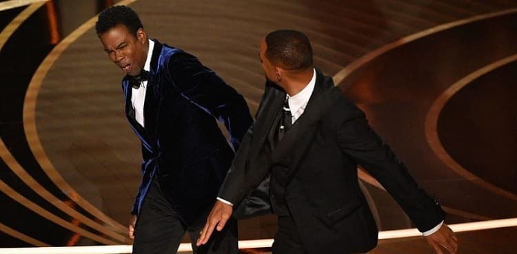 Chris Rock unleashes on Will Smith and wife Jada a year after Oscars slap