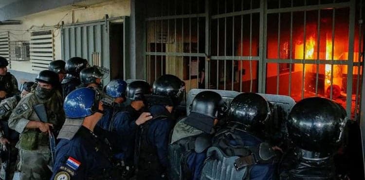 Police officer, 7 inmates die in Paraguay prison operation