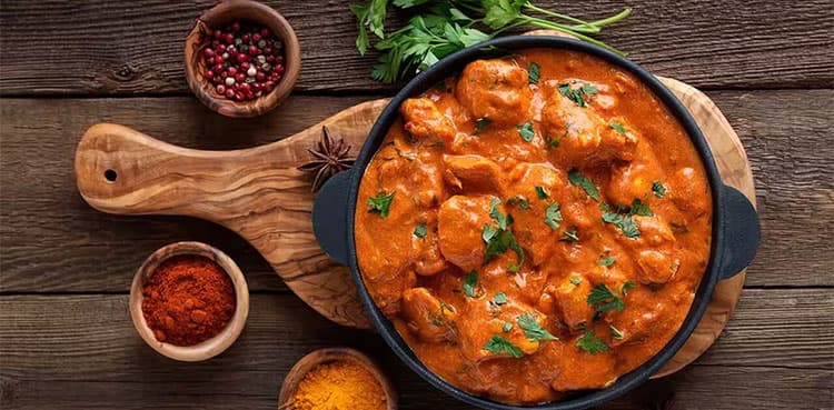 Who invented butter chicken?
