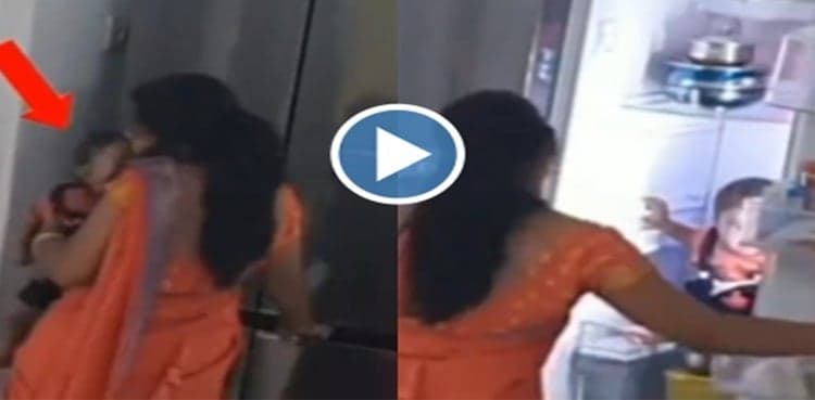 WATCH: Woman puts baby in fridge while busy on phone