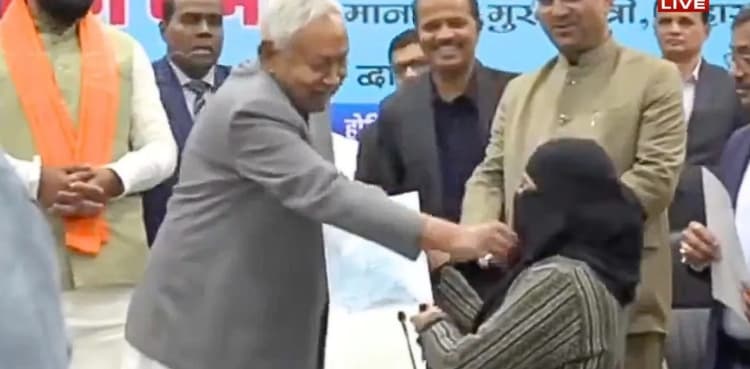 India: Bihar CM Nitish Kumar pulls down Muslim woman's hijab